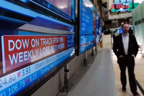 US stocks trade mixed as business activity improves while earnings season heats up
