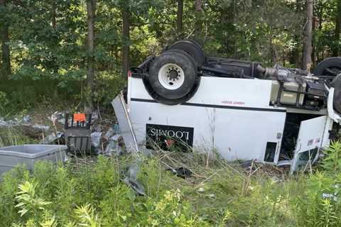 Armored truck rolls, sends money bags flying in Michigan